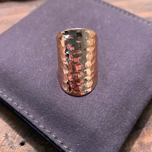 Rose gold color. Wide band.